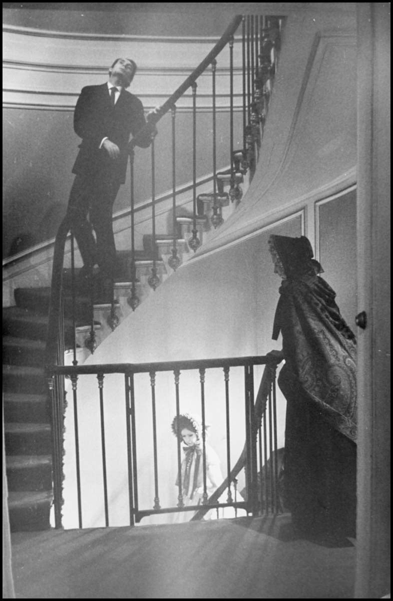 Cardin, Pierre. (b. 1922) [Anonymous] Designer and Models on Staircase