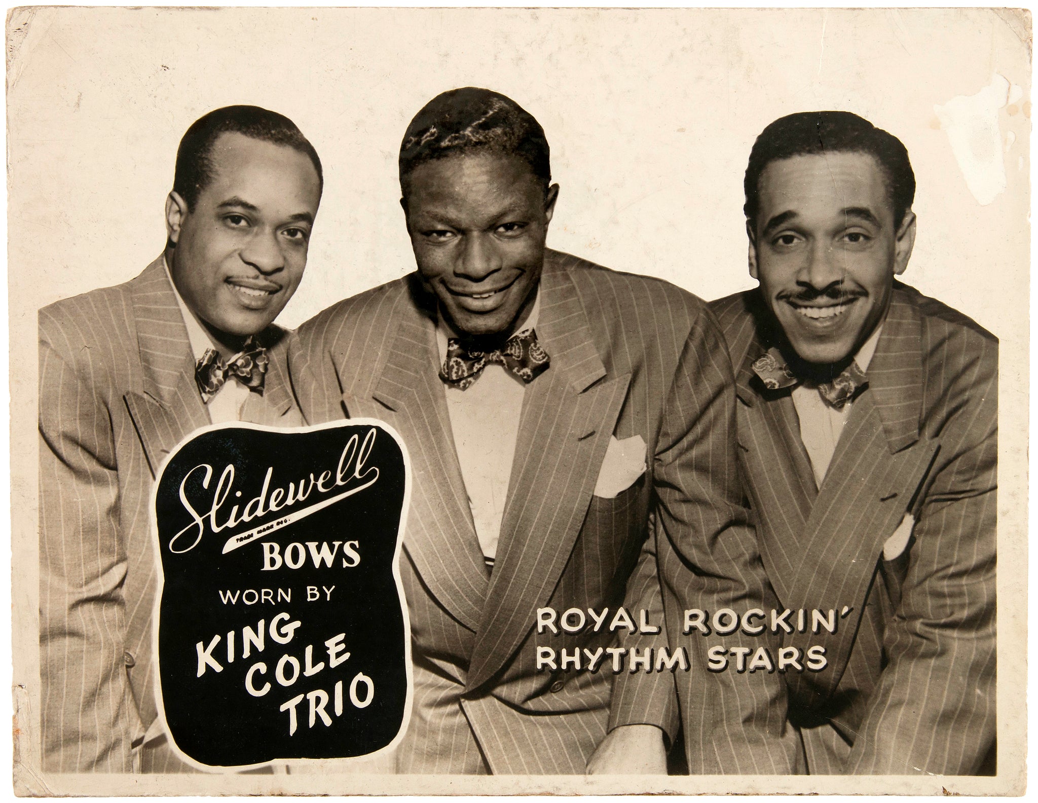 [Cole, Nat King. (1919–1965)] King Cole Trio Bow Tie Display, Ca. 1944